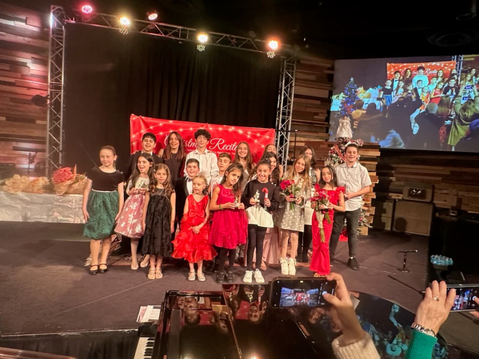 ABA Music Academy students gathered on stage at the recital finale